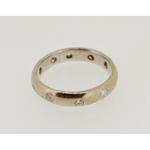 477 - An 18 carat gold eternity ring inset diamonds, 45g, size K, 4.5g