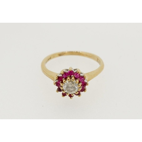 478 - A 9 carat gold ruby and diamond cluster ring, centre stone approx 1/4 carat, 1.8g, size J