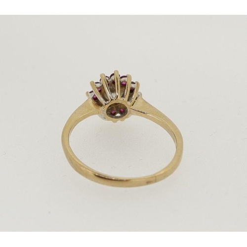 478 - A 9 carat gold ruby and diamond cluster ring, centre stone approx 1/4 carat, 1.8g, size J