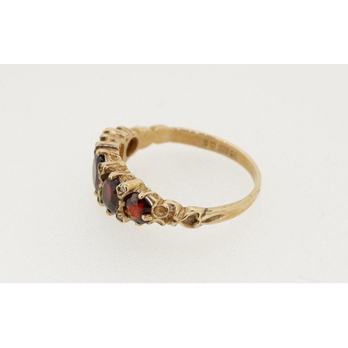 479 - A 9 carat gold five stone garnet ring, size M