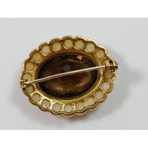 488 - A 9 carat gold oval brooch set citrine in pearl surround, 2.8 x 2.2cm, 6.6g