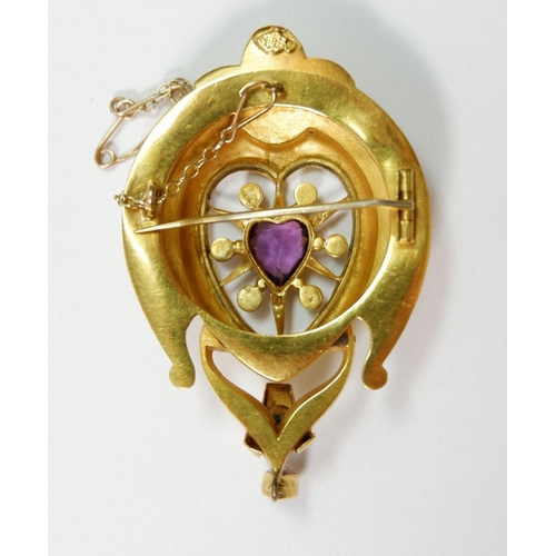 497 - A large Victorian brooch set central heart cut amethyst within pearl surround and ornate yellow meta... 