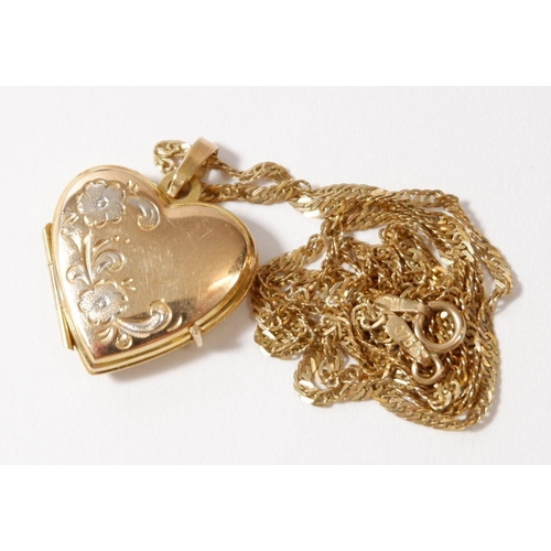 498 - A 9 carat gold heart form locket engraved flowers on 9 carat gold chain, 3.7g