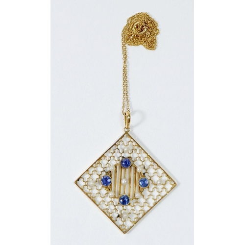 509 - An Edwardian 15ct gold square openwork pendant set sapphires and seed pearls, in original box with 1... 