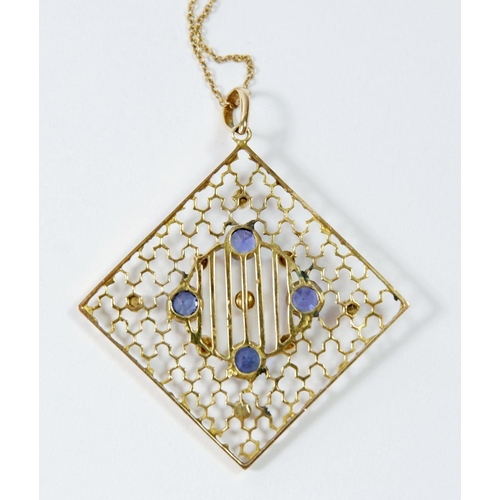 509 - An Edwardian 15ct gold square openwork pendant set sapphires and seed pearls, in original box with 1... 