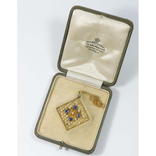 509 - An Edwardian 15ct gold square openwork pendant set sapphires and seed pearls, in original box with 1... 