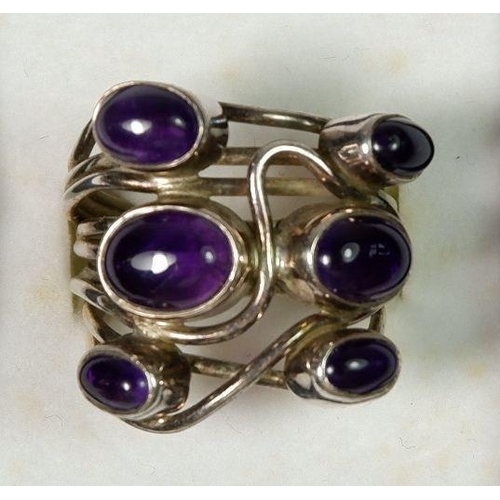 591 - A silver studio designed amethyst set ring, 12g, size N to O