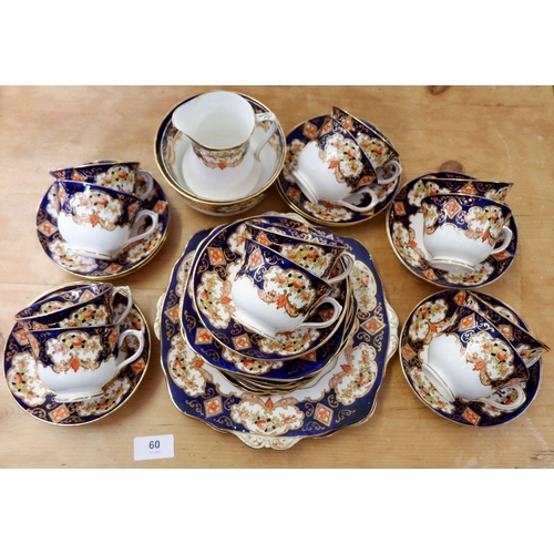 60 - An Edwardian Royal Albert tea service comprising twelve cups and saucers, two cake plates, sugar and... 