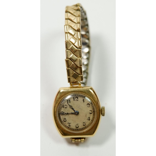 652 - A 9ct gold ladies wrist watch on plated strap