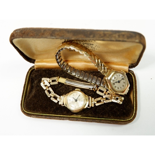 653 - An Avia 9 carat gold ladies wrist watch and gold plated strap and another 'Dot' 9 carat watch on pla... 