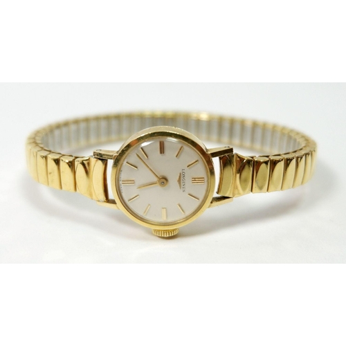 654 - A Longines 18 carat gold ladies wrist watch on gold plated strap