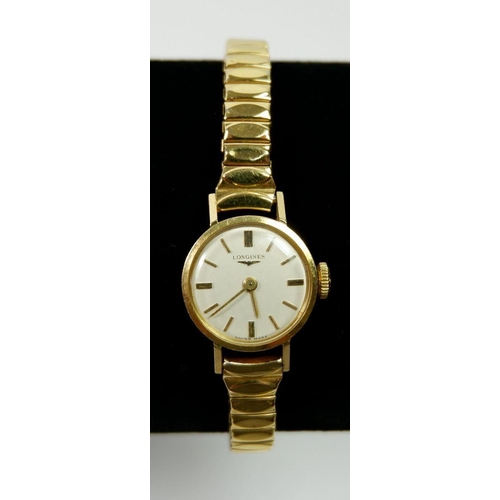 654 - A Longines 18 carat gold ladies wrist watch on gold plated strap