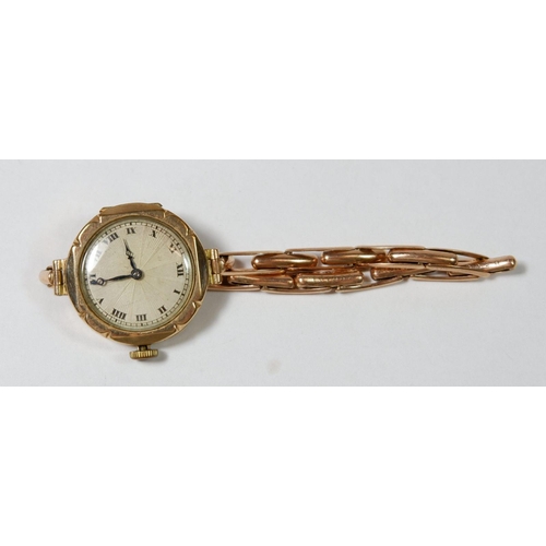 676 - A 9 carat gold ladies wrist watch on gold plated strap