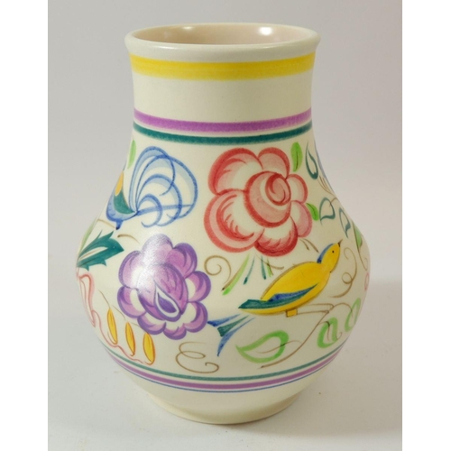 69 - A Poole pottery vase painted yellow birds and flowers, 18cm tall