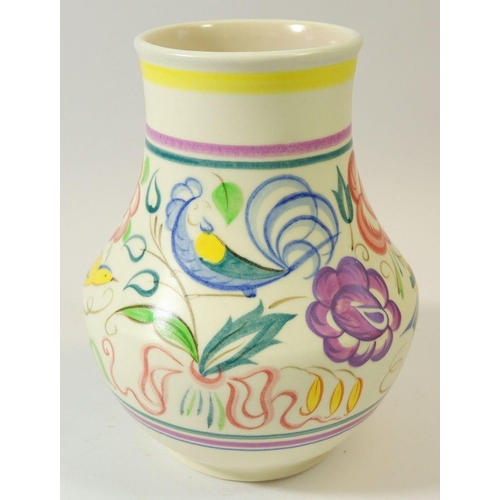 69 - A Poole pottery vase painted yellow birds and flowers, 18cm tall