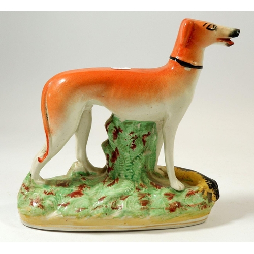 70 - A Victorian Staffordshire greyhound, 17cm tall and similar zebra