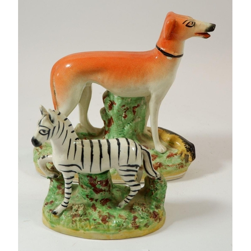 70 - A Victorian Staffordshire greyhound, 17cm tall and similar zebra