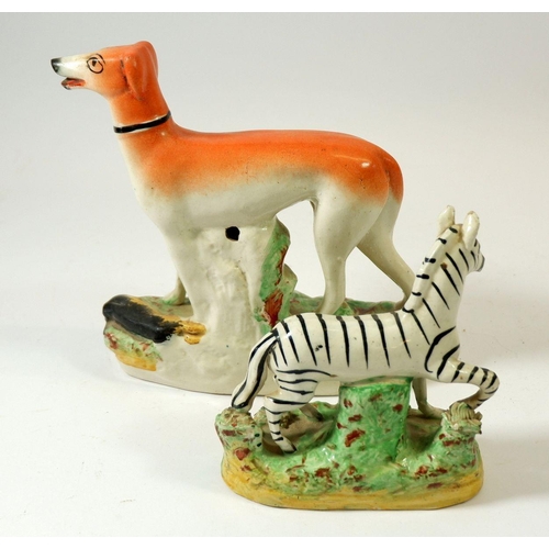 70 - A Victorian Staffordshire greyhound, 17cm tall and similar zebra