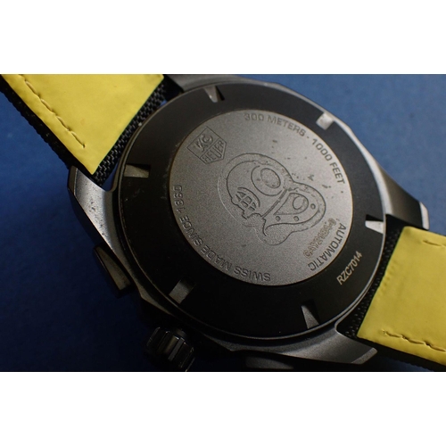 707 - A gentleman’s black ceramic Tag Heuer Aquaracer wrist watch with black fabric strap and yellow stitc... 