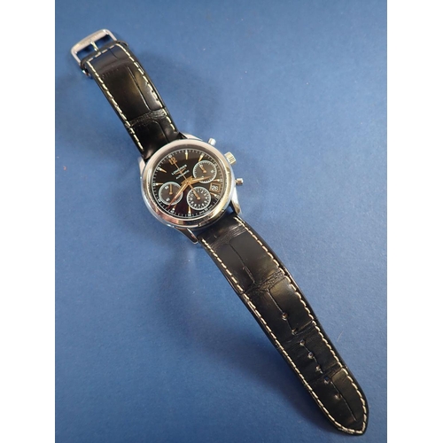 709 - A fine Longines column wheel chronograph wrist watch on black leather strap with automatic movement,... 