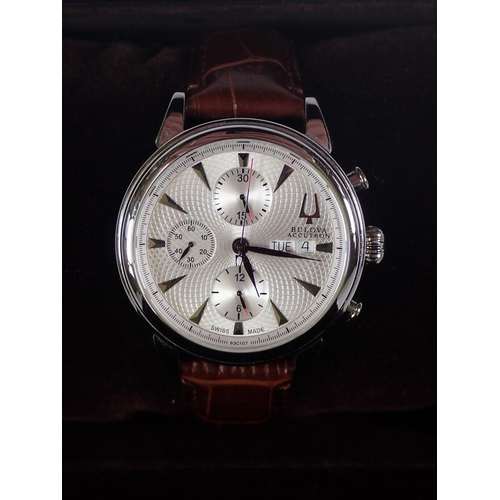 713 - A gentleman’s automatic stainless steel Bulova Gemini wrist watch on brown leather strap accompanied... 