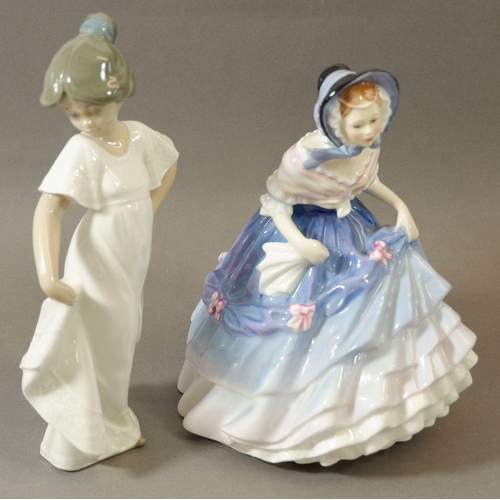 73 - A Royal Doulton figure Alice, HN 3368 and a Nao figure