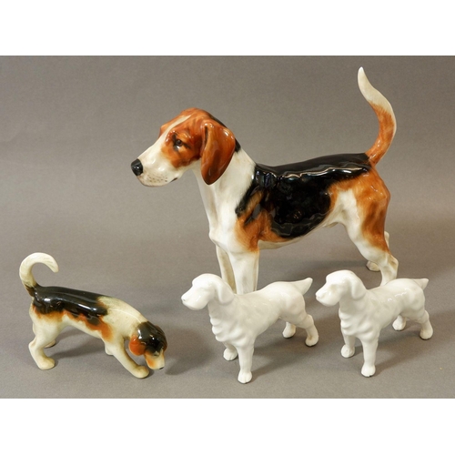 77 - A Royal Doulton fox hound and three other dogs