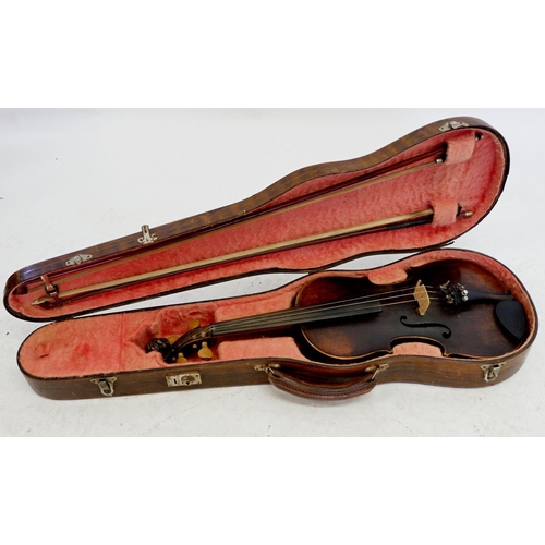 787 - An antique violin with lion head scroll and two bows, in case - no label, 14