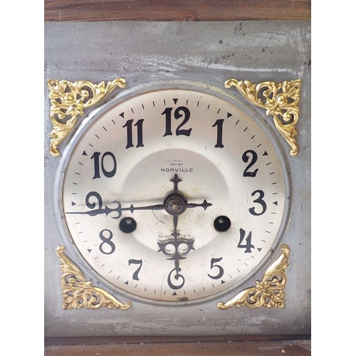 810 - A Victorian oak mantel clock with silvered dial, 35cm tall