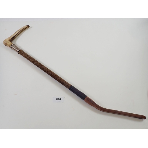 816 - A Swaine & Adeney horn handled riding crop with silver plated collar