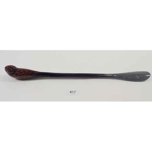 817 - A lacquer shoe horn with owl terminal, 43cm