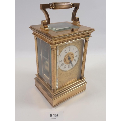 819 - A Victorian brass carriage clock with four columns and repeater striking movement, 16cm to top of ca... 