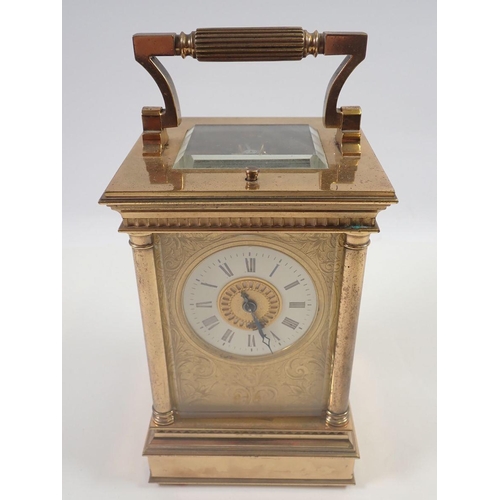 819 - A Victorian brass carriage clock with four columns and repeater striking movement, 16cm to top of ca... 