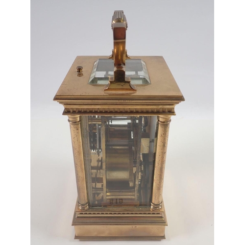 819 - A Victorian brass carriage clock with four columns and repeater striking movement, 16cm to top of ca... 