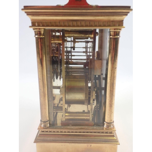 819 - A Victorian brass carriage clock with four columns and repeater striking movement, 16cm to top of ca... 