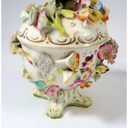 82 - A Dresden porcelain candlestick painted flowers, a floral encrusted pot and cover and a porcelain bo... 