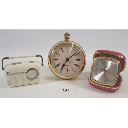 821 - A Topflite travel clock, novelty transistor radio clock and one other