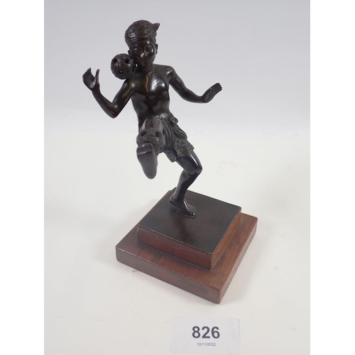 826 - A bronze figure of a Japanese boy playing ball, 14cm tall