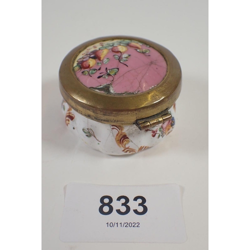 833 - A 19th century enamel circular pill boxpainted fruit and flowers, 4.5cm diameter, a/f