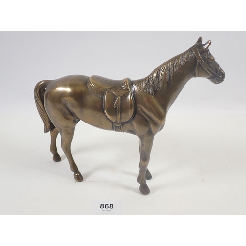 868 - A brass figure of a racing horse, 19cm tall