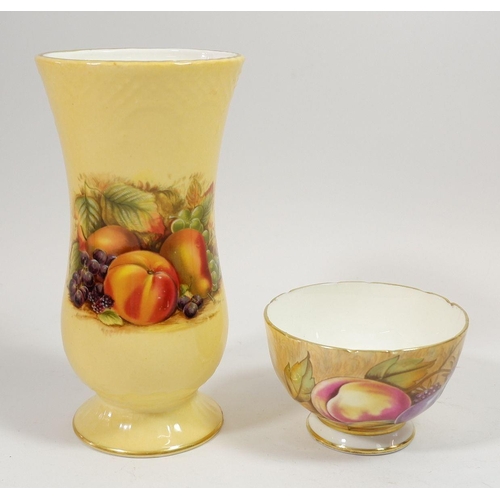 87 - An Aynsley tea bowl printed fruit and a similar vase , 15cm