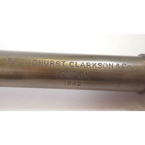 891 - A brass telescope inscribed Broadhurst Clarkson dated 1942, a canon ball, shell fuse and brass lens/... 