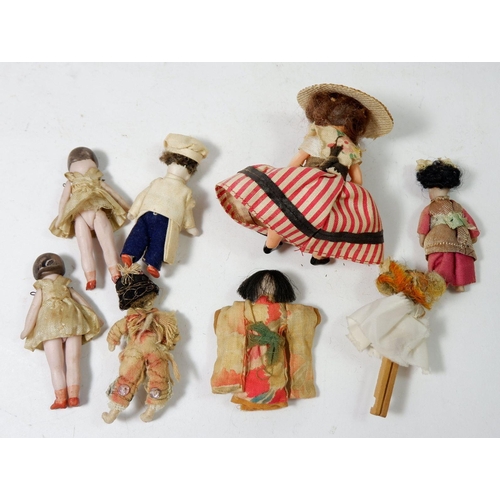 908 - A group of dolls house dolls and five bisque dolls, approx. 7cm