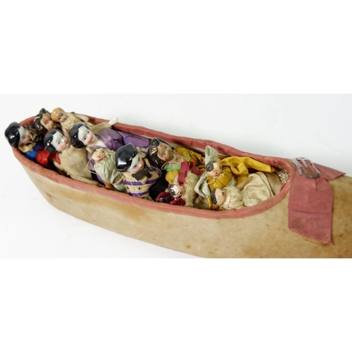 909 - A Victorian 'Old Woman Who Lived in a Shoe' set with fabric shoe filled with porcelain headed childr... 