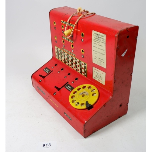 913 - A tin plate vintage toy telephone exchange