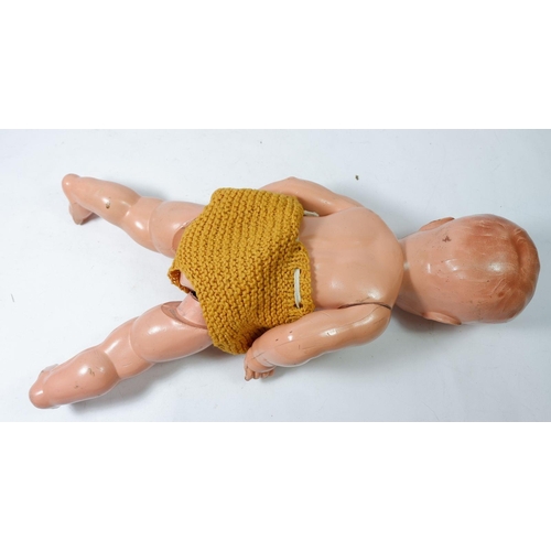 918 - A vintage composition doll with cry