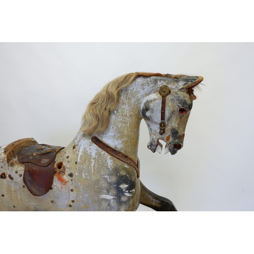 922 - An antique Ayres style dapple grey rocking horse in need of restoration, 120 x 140cm