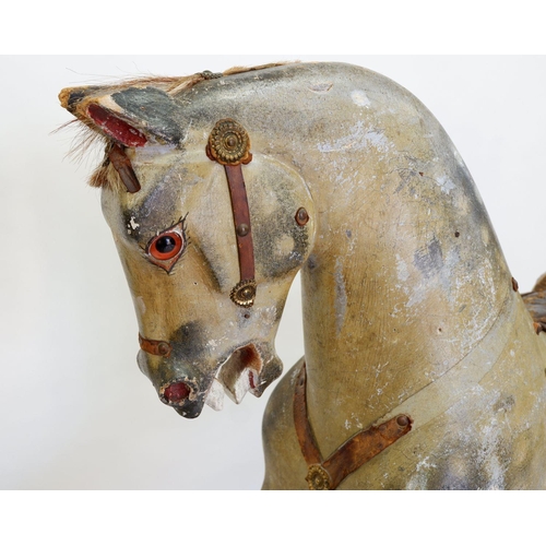 922 - An antique Ayres style dapple grey rocking horse in need of restoration, 120 x 140cm