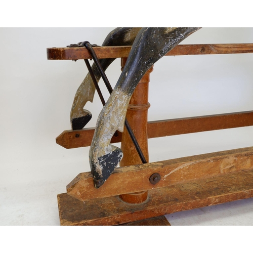 922 - An antique Ayres style dapple grey rocking horse in need of restoration, 120 x 140cm