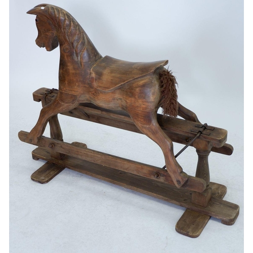 923 - A carved wood rocking horse on stand, 89cm tall